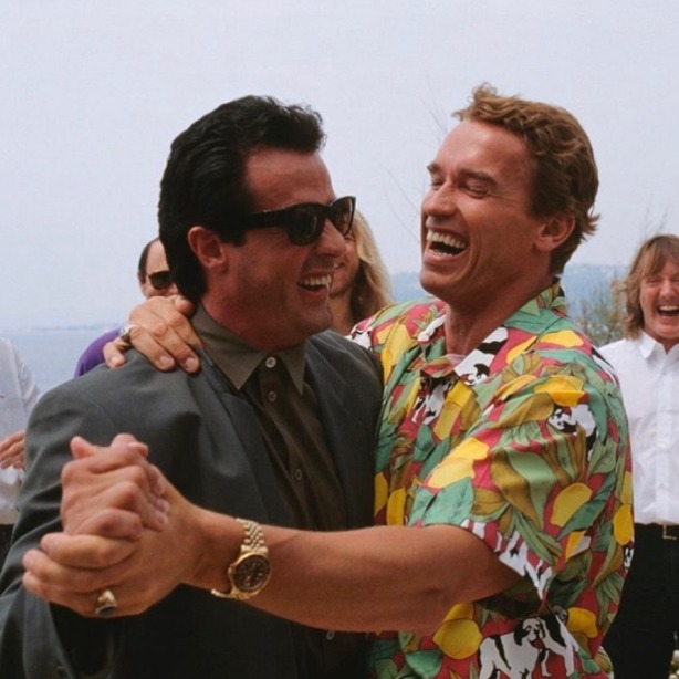 Stallone and Schwarzenegger slow dancing